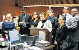  ?? Marcus Yam
Los Angeles Times ?? L.A. COUNTY social workers Patricia Clement, left, and Stefanie Rodriguez, third from left, are arraigned in Los Angeles along with their respective supervisor­s, Gregory Merritt, fourth from right, and Kevin Bom, second from right.