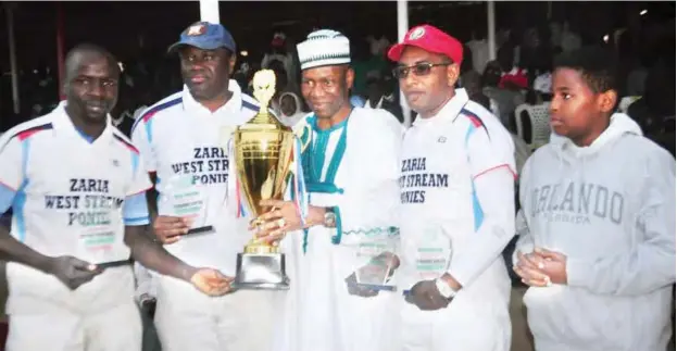  ??  ?? President of Nigerian Polo Federation, Francis Ogboro (middle) presents a cup to Zaria West Stream Ponies players, one of the major winners of the 2017 Jos annual Polo Tournament last December. FIP has single out Ogboro led NPF for its commitment in...