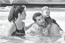  ?? DIA DIPASUPIL, GETTY IMAGES ?? “We’re not gods,” Michael Phelps, with wife Nicole and son Boomer, says of athletes. “I’m human like everybody else.”