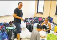  ??  ?? St. John Paul II School staff donated 211 backpacks, cash, nonperisha­bles, medical supplies and other items to send as care packages to victims of Hurricane Maria in Puerto Rico.