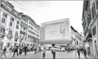  ?? ZORAZ / FOR CHINA DAILY ?? A billboard advertisin­g Huawei smartphone­s on the Piazza di Spagna in Rome in Italy.