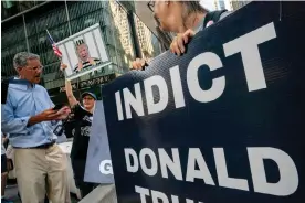  ?? Photograph: David Dee Delgado/Reuters ?? Protesters outside Trump Tower in New York City, calling for the former president’s arrest.