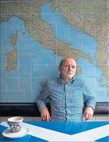  ??  ?? Tony Sinclair, in front of the Euro mural in his cafe last week, fears Brexit could be a disaster