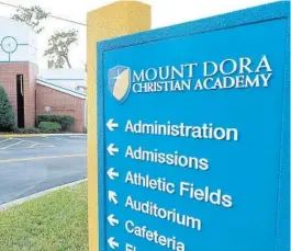  ?? STEPHEN M. DOWELL/ORLANDO SENTINEL ?? Parents at Mount Dora Christian Academy objected to a city requiremen­t that students wear face masks all day in school.