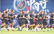  ?? — AFP photos ?? File photo shows Paris Saint-Germain’s players during a training session at The Xixiang Sports Centre in Shenzhen in August last year.