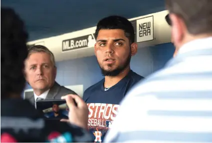  ?? The Associated Press ?? ■ Houston Astros relief pitcher Roberto Osuna is interviewe­d in the dugout Sunday before a baseball game against the Los Angeles Dodgers in Los Angeles. Osuna served a 75-game suspension for violating Major League Baseball’s domestic violence policy.