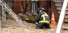  ?? Staff fILE photo by Mark GarfInkEL ?? TRAGIC: A firefighte­r responds to the fatal trench flooding and collapse that killed two men Oct. 21 on Dartmouth Street in the South End.