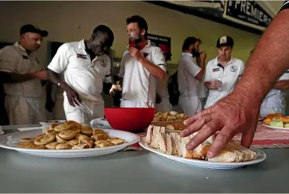  ??  ?? The cricketers’ tea could be bowled out of the game as a coronaviru­s precaution.