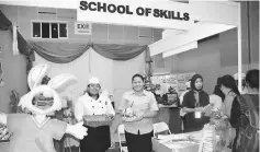  ??  ?? Yahos School of Skills holding a fondant cake made by their students.