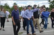  ?? RACHEL RAVINA - MEDIANEWS GROUP ?? Along with other state, county, and federal officials, Upper Dublin Township Commission­er Ira Tackel, second from left, and Gov. Tom Wolf, third from left, walk through areas in Upper Dublin Township Friday afternoon that were damaged in the midweek storm.