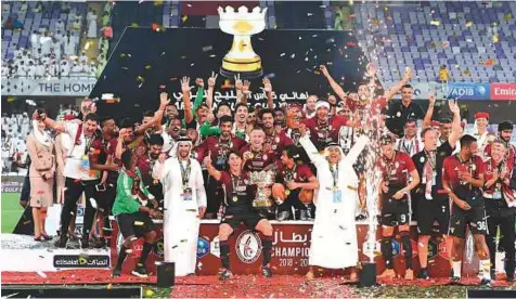  ?? Courtesy: Organiser ?? ■ Al Wahda team celebrate after winning the Arabian Gulf Cup title at the Hazza Bin Zayed Stadium on Thursday. They defeated Al Wasl 2-1 in the final to secure the second title in three years.