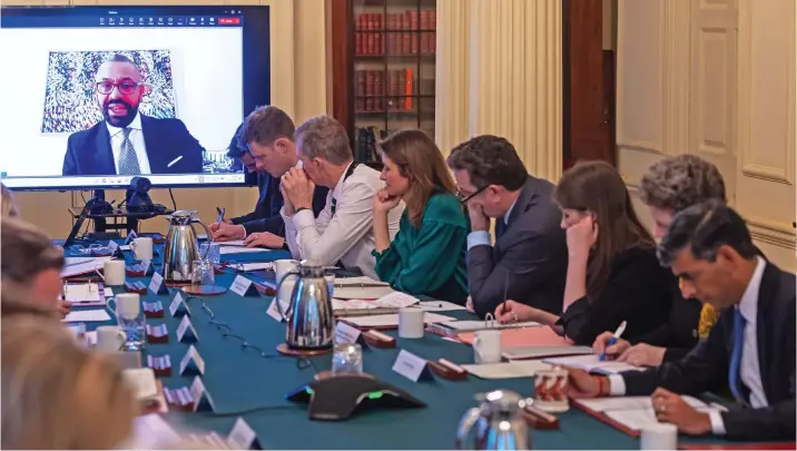  ?? ?? Updating colleagues: James Cleverly, who was in Rwanda, takes part via videolink in the weekly Cabinet meeting hosted by Prime Minister Rishi Sunak yesterday