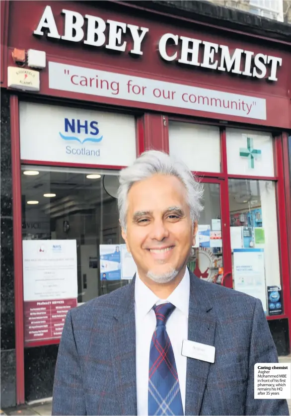  ??  ?? Caring chemist Asgher Mohammed MBE in front of his first pharmacy, which remains his HQ after 35 years