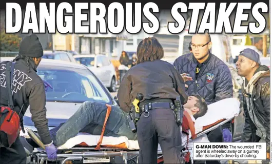  ??  ?? G-MAN DOWN: The wounded FBI agent is wheeled away on a gurney after Saturday’s drive-by shooting.