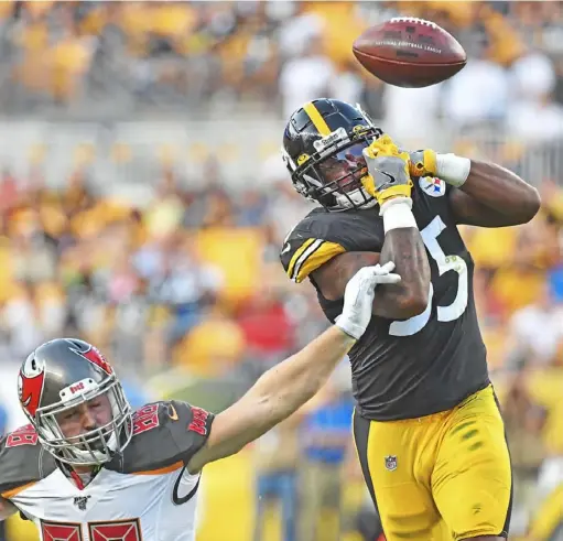  ?? Peter Diana/Post-Gazette ?? Steelers linebacker Devin Bush breaks up a pass intended for Tampa Bay Buccaneers tight end Tanner Hudson.