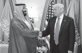  ?? Mandel Ngam / AFP/Getty Images ?? President Donald Trump and Saudi Crown Prince Mohammed bin Salman al-Saud met in Riyadh. Trump on Wednesday thanked Saudi Arabia for lower oil prices — a day after vowing the U.S. would stay a partner despite the murder of a journalist.