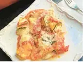  ?? GRETCHEN MCKAY/PITTSBURGH POST-GAZETTE ?? Sliced zucchini stands in for pasta noodles in these lasagna roll-ups.