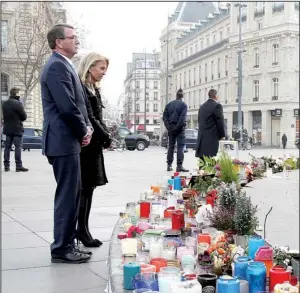  ?? AP/U.S. Embassy/S. DE GELDER ?? Defense Secretary Ashton Carter and U.S. Ambassador to France Jane Hartley stand Wednesday in Paris at a memorial to those killed in terrorist attacks in France. In talks with defense ministers, Carter laid out U.S. plans for a coordinate­d campaign...