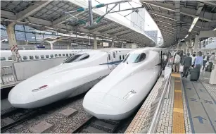  ??  ?? Passengers get on the Shinkansen high-speed train at Tokyo station in Tokyo. The building and operation of Japan’s Shinkansen encapsulat­e the pros and cons of the planned Kuala LumpurSing­apore high-speed rail.