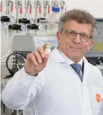  ??  ?? PLURISTEM CHAIRMAN AND CO-CEO Zami Aberman holds a vial of specialize­d stem cells the company calls ‘the next generation of biological therapeuti­c products.’