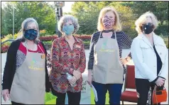  ?? (NWA Democrat-Gazette/Carin Schoppmeye­r) ?? Susan Bolding (from left) volunteer; Charlotte Taylor, Botanical Garden of the Ozarks executive director; Tresha Jacky, volunteer; and Catherine Hipp, board member, welcome guests to the Greening of the Garden.