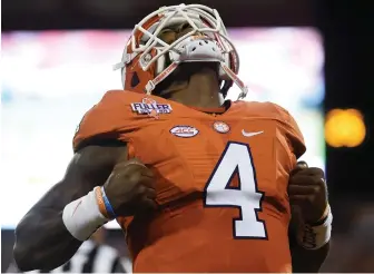  ??  ?? ALL PUMPED UP: Clemson quarterbac­k Deshaun Watson reacts after throwing a touchdown pass in the first half against Louisville last night.