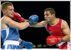  ?? ?? David Light won silver at the 2014 Commonweal­th Games in Glasgow, losing to Canada’s Samir El-Mais, right, in a tight final.