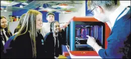  ?? Adelson Educationa­l Campus ?? Students at the Dr. Miriam and Sheldon G. Adelson Educationa­l Campus in Summerlin work to print 3D supplies.