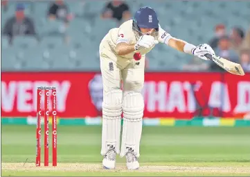  ?? ?? England skipper Joe Root is struck by a delivery from Mitchell Starc during Day 4 of the second Ashes Test on Sunday.