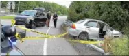  ?? TOM KELLY III — FOR DIGITAL FIRST MEDIA ?? Police examine the scene of a crash at the Farmington Avenue exit off Route 100 that occurred after a brief police chase. The driver, wanted for stealing the car at knifepoint, escaped capture.