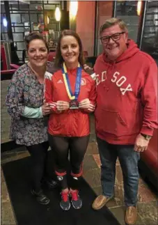  ?? PHOTO COURTESY ALLIE MACNEILL ?? Phoenixvil­le native Allie MacNeill poses with her mom Lisa and her Dad Steve after finishing the Boston Marathon Monday.