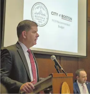  ?? STAFF PHOTO BY MARK GARFINKEL ?? SPENDING PLAN: Boston Mayor Martin J. Walsh presents the fiscal 2019 city budget yesterday during a breakfast with municipal officials and city councilors. The $3.29 billion budget is a 4.3 percent increase.