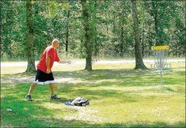  ?? (NWA Democrat-Gazette/Lynn Atkins) ?? Bryan Huffman described the Bella Vista Disc Golf Course as “awesome.” Whenever he visits his father, a Property Owners Associatio­n member, he plays a round on the course. It’s good, inexpensiv­e exercise, he said.