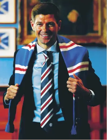  ??  ?? Liverpool legend Steven Gerrard is all smiles after being unveiled as the new manager of Rangers. The former Champions League winner signed a four-year contract