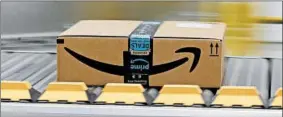  ?? RICH PEDRONCELL­I/AP ?? Federal regulators have said Amazon’s contract with the Postal Service is profitable.
