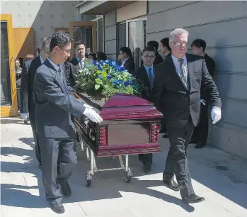  ?? JASON PAYNE ?? Pallbearer­s carry the casket of 13-year-old Marrisa Shen following her funeral service at Mountain View Cemetery in Vancouver on Friday. The casket was adorned with blue roses, her favourite flower.