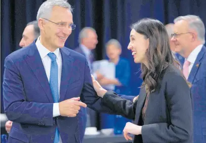  ?? Photo / AP ?? Jacinda Ardern catches up with Nato Secretary General Jens Stoltenber­g in Madrid.