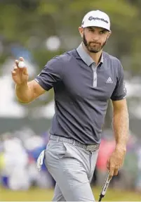  ?? SETH WENIG/ASSOCIATED PRESS ?? Dustin Johnson holds a two-shot lead at the U.S. Open heading into today’s third-round lead at Shinnecock Hills in New York.