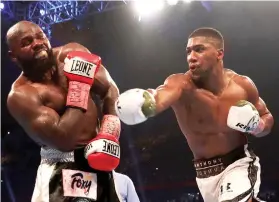  ?? AP FOTO ?? UNDEFEATED. Anthony Joshua scored his 20th straight win by knockout and retained his heavyweigh­t belts.