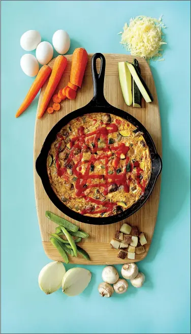  ?? St. Louis Post-Dispatch/TNS/DAVID CARSON ?? Hot Mess Frittata combines potatoes, peppers, tomatoes, mushrooms and zucchini.