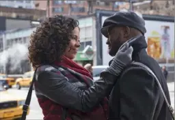  ?? ?? Sanaa Lathan and Taye Diggs in a scene from “The Best Man Holiday.”