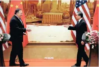  ?? PICTURE: JASON LEE/REUTERS ?? US Secretary of State Mike Pompeo walks to shake hands with Chinese Foreign Minister Wang Yi after a joint news conference at the Great Hall of the People in Beijing, China, yesterday.