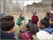  ?? TYLER RIGG — THE NEWS-HERALD ?? Valerie Reinhardt, horticultu­re manager of Farmpark, explains her process of boiling sap to create maple syrup.