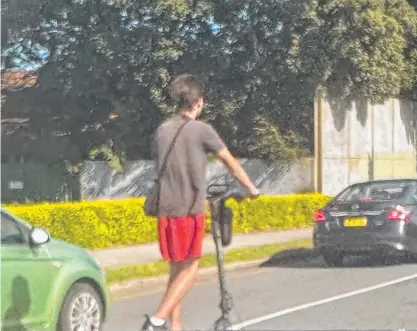  ?? ?? An electric scooter rider at Bundall on the Gold Coast.