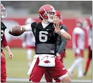  ?? NWA Democrat-Gazette/ANDY SHUPE ?? Arkansas quarterbac­k Ben Hicks prepares to throw during practice Friday in Fayettevil­le. “It was cold out there,” Hicks said. “I never thought I’d say I miss Texas weather, but no, it was good to be back out there.”