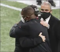  ?? CURTIS COMPTON - ASSOCIATED PRESS ?? Atlanta Falcons head coach Raheem Morris, left, and Las Vegas Raiders head coach Jon Gruden greet each other with a hug after the Falcons defeated the Raiders in an NFL football game on Sunday, Nov. 29, 2020, in Atlanta.