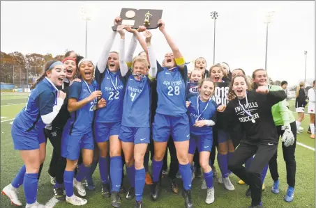  ?? Gregory Vasil / For Hearst Connecticu­t Media ?? Lewis Mills celebrates their win in the Class M championsh­ip on Sunday in West Haven.