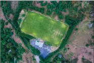  ??  ?? Kilmacanog­ue GAA Club from the air last Friday evening.