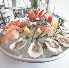  ?? GARY PORTER / FOR THE JOURNAL SENTINEL ?? Le Grand Plateau is a large seafood tower served at Cafe Grace, a French restaurant operated by the Bartolotta group in Wauwatosa.