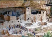  ?? AP 2005 ?? Visitors tour Cliff Palace,an ancient cliff dwelling in Mesa Verde National Park, Colo. Researcher­s say they have new evidence that ancient people who disappeare­d from the dwellings moved to what is now New Mexico.